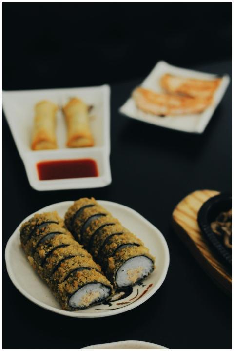 A mouthwatering spread of fried sushi, spring roll