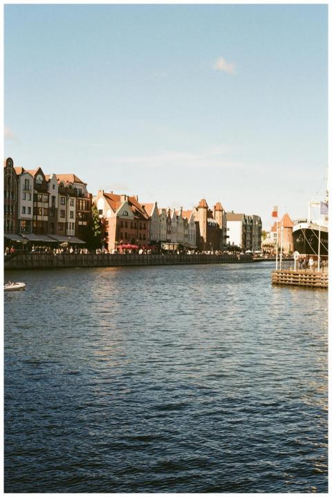 Charming waterside view of Gdańsk's historic archi