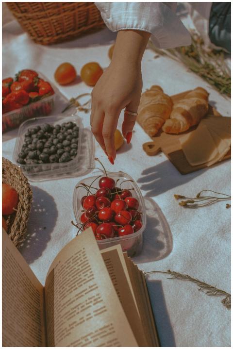 A delightful outdoor picnic featuring berries, cro
