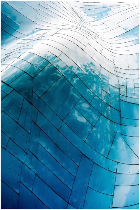 Curved metal facade with abstract and futuristic a