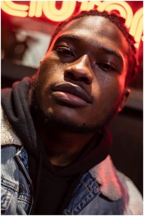 Masculine African American male with dreadlocks we