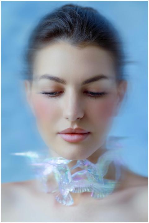 A soft focus portrait of a woman with an ethereal,