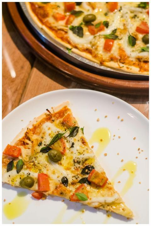 Close-up of a delicious pizza slice with toppings