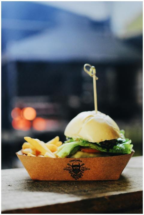 Delicious gourmet burger with crispy fries served