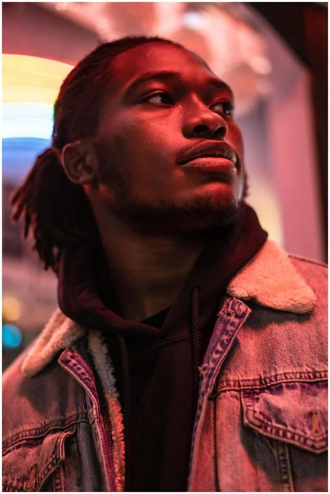 Pensive African American young man in trendy cloth