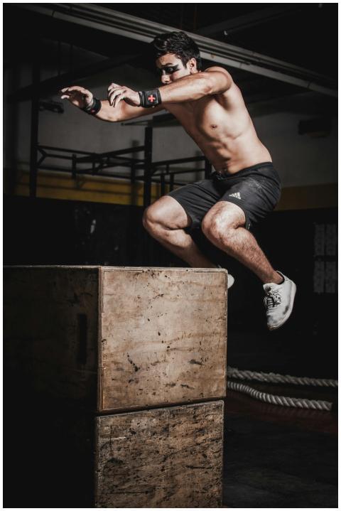 Shirtless man showcasing strength and fitness with