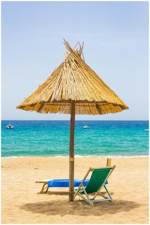 Serene beach scene in Sardinia, Italy featuring a