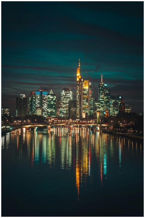Illuminated skyline of Frankfurt at night with sky