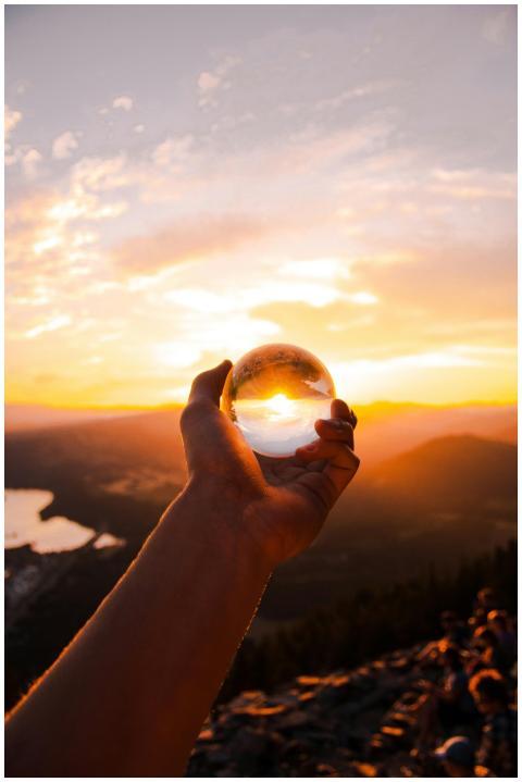 Captivating sunset view reflected in a crystal bal