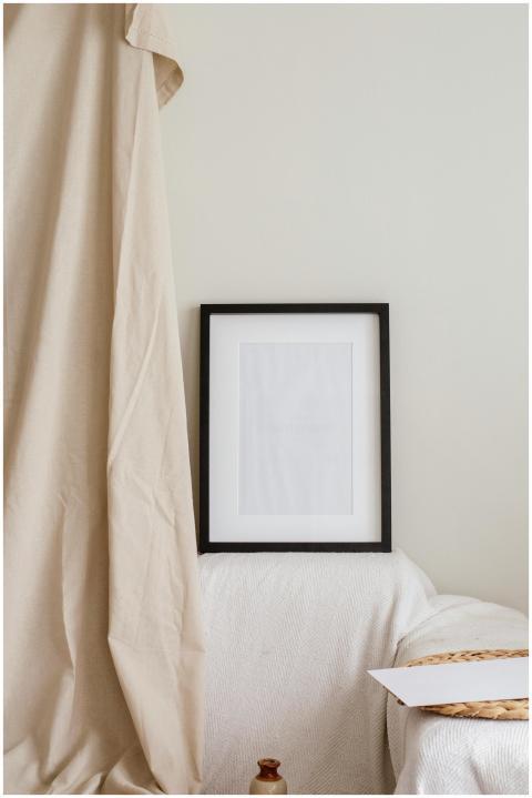 Neutral-toned minimalist interior featuring a blac