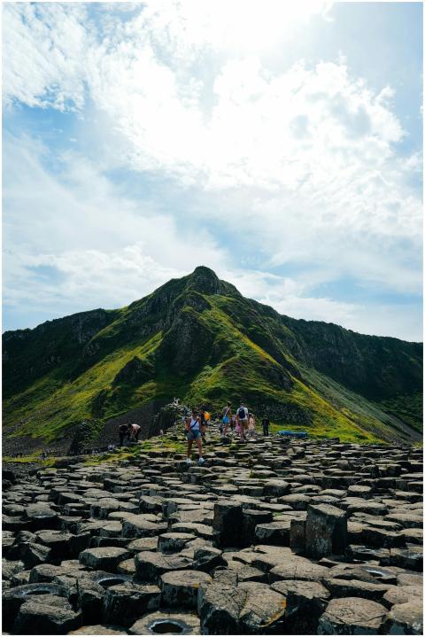 Tourists walking on the iconic basalt columns of G