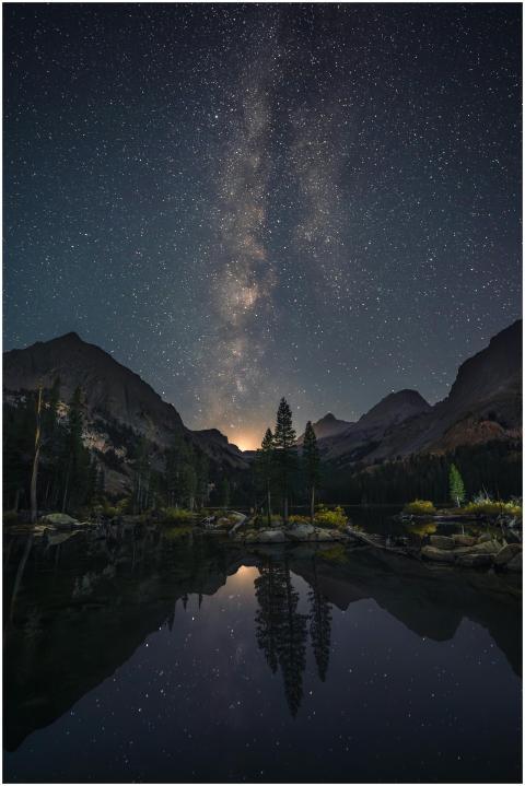Captivating Milky Way reflection over a serene mou