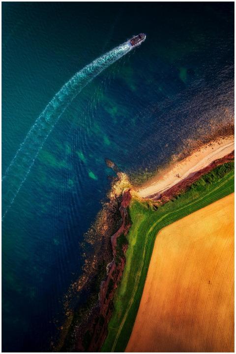 Stunning aerial shot of a boat near Budleigh Salte