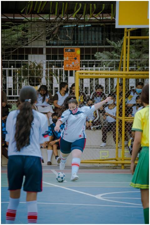 Teen girls playing indoor soccer in Guayaquil, Ecu