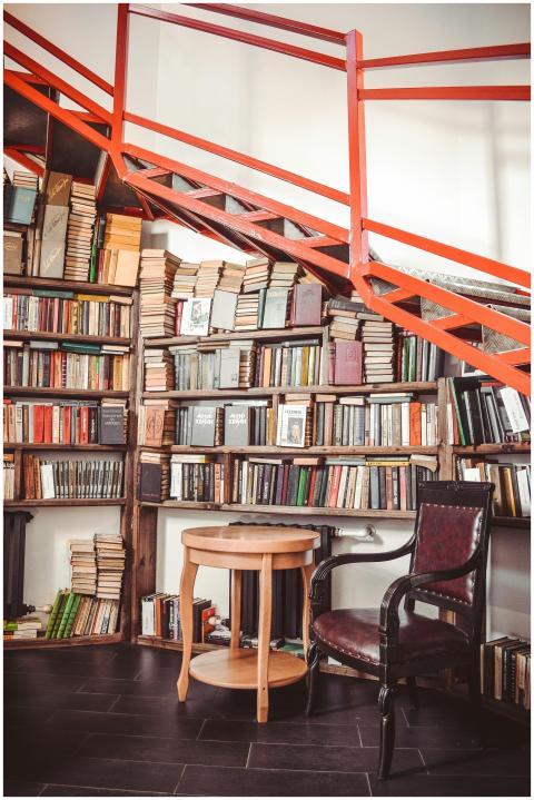 A cozy library corner featuring bookshelves, a woo