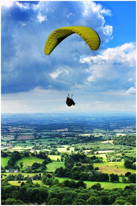 Experience thrilling paragliding over scenic Malve