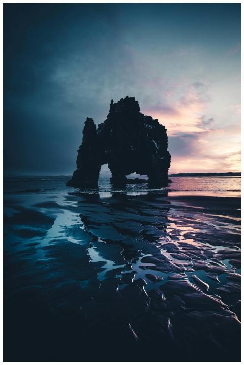 Captivating twilight scene with a striking rock fo