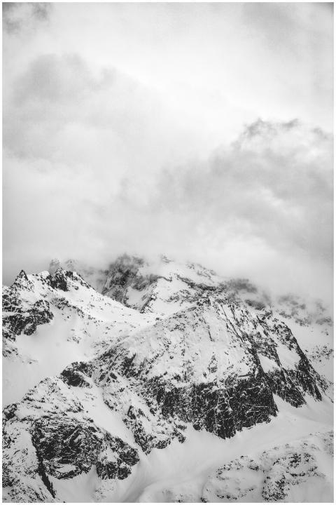 Dramatic monochrome photo of snow-covered mountain
