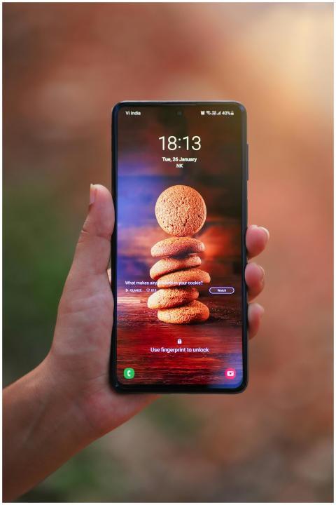 Close-up of a hand holding a smartphone with a coo