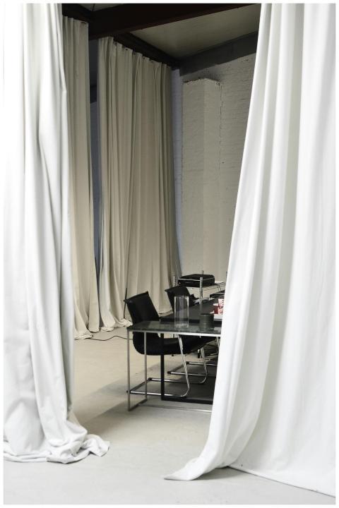 Modern office setting with elegant white curtains