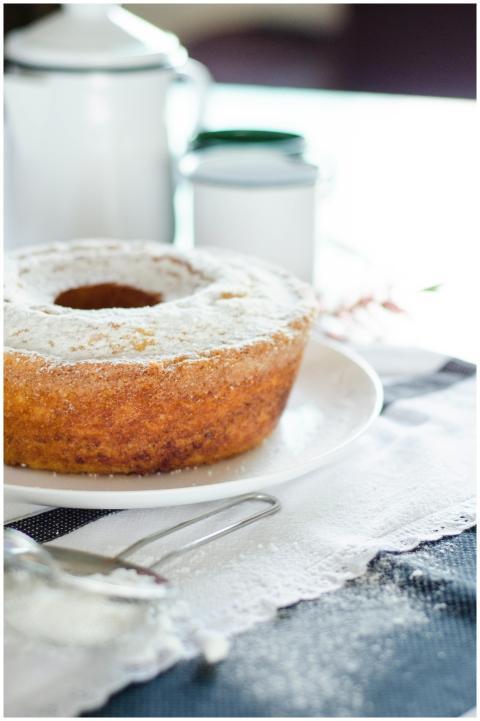 A freshly baked homemade cake dusted with powdered