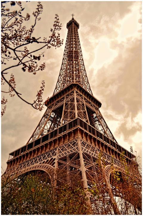 Low angle view of the Eiffel Tower against a drama