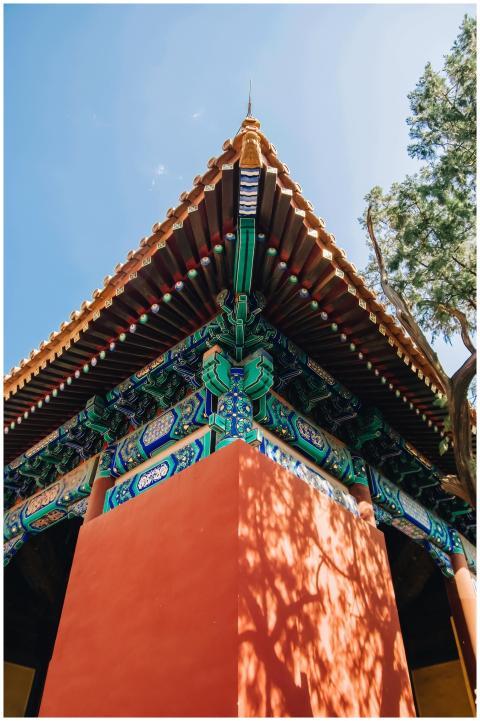Close-up of a colorful, ornate temple roof with tr