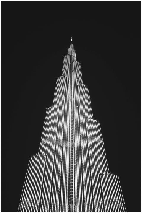 Black and white photo of Burj Khalifa at night, sh