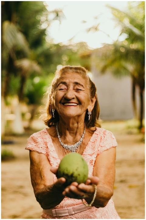 Smiling elderly woman with jewelry showcases happi