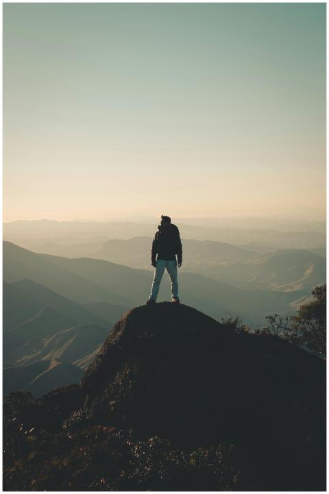 A man enjoys a breathtaking view from a mountain p