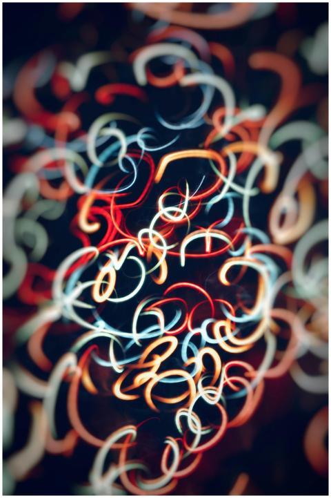 Dynamic abstract image featuring colorful light sw