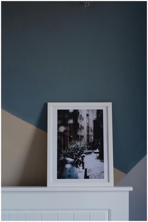 Minimalist interior featuring a framed urban photo