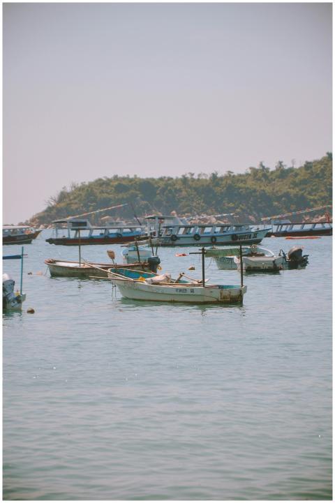 Peaceful coastal scene featuring anchored fishing