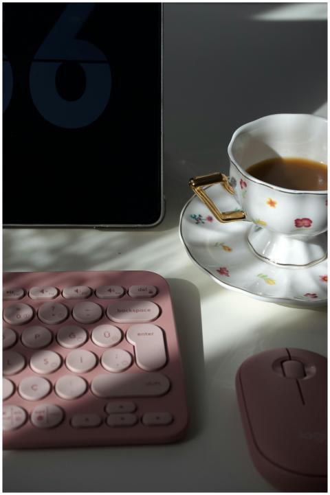 Aesthetic workspace featuring pink keyboard, mouse