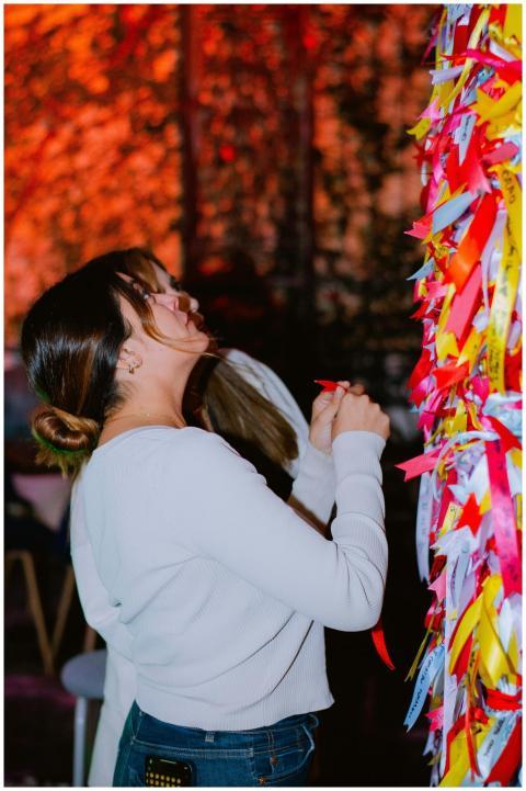 Woman Interacts Colorful Ribbon