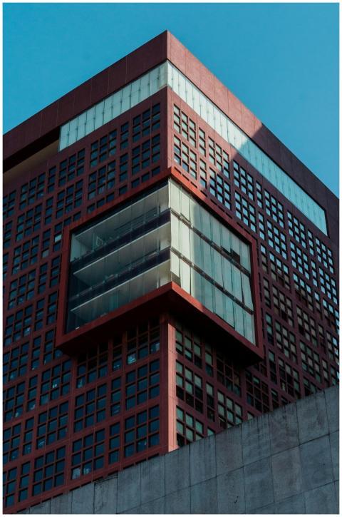 Abstract view of a geometric urban building agains