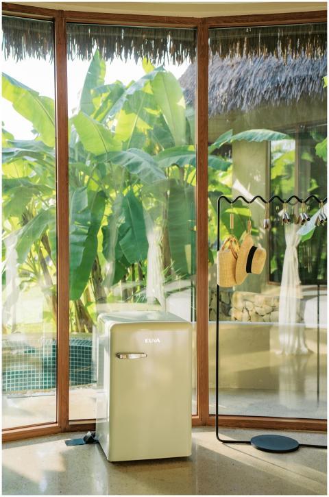 Chic modern interior featuring a mini fridge and t