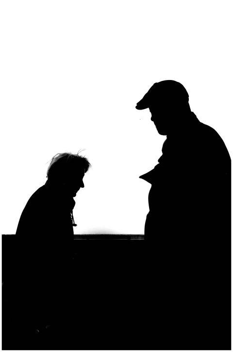 High contrast silhouette photo capturing two adult