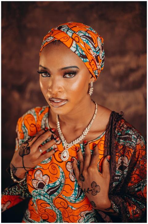 Portrait of a woman in vibrant African print dress