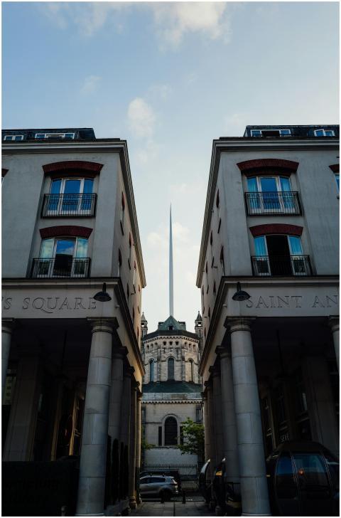 Symmetrical view of modern buildings framing a dis