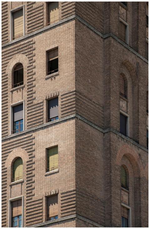 Close-up of an ornate brick corner on a historic b
