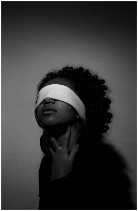 A striking black and white portrait of a blindfold