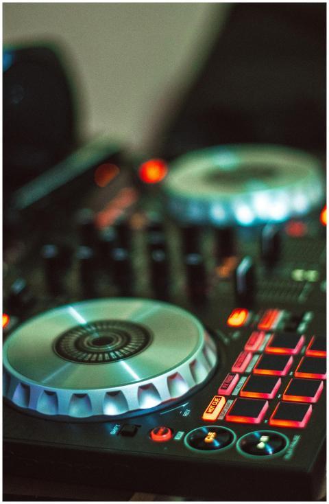 Close-up photo of a DJ controller with illuminated