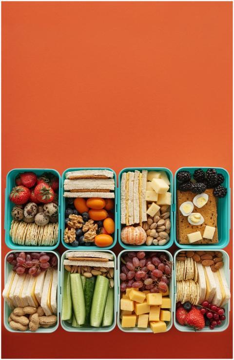 Top view of diverse snack boxes arranged neatly on