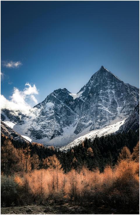 A breathtaking view of a snowy mountain behind an