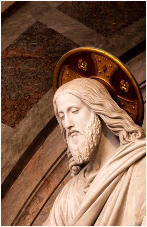 Graceful marble statue of Jesus Christ with a gold