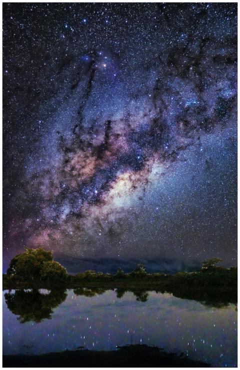 A breathtaking view of the Milky Way galaxy reflec