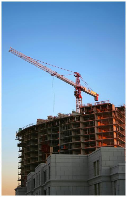 Tower crane on a high-rise building under construc