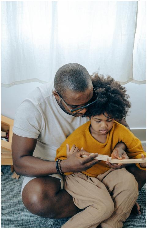 A father and daughter sharing a warm moment readin