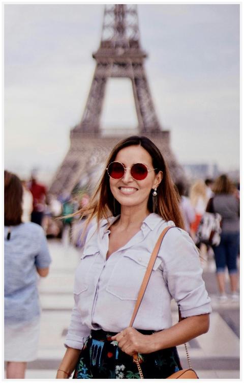 Woman enjoying Paris vacation at Eiffel Tower, Fra